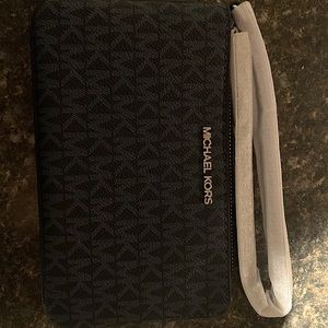 Michael Kors large wristlet. Never used with tags.
